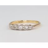 A yellow metal 18ct 5 stone diamond ring, size M, 2 grams