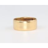 An 18ct yellow gold wedding band size K, 5.3 grams