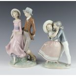 A Lladro group of a embracing young couple 24cm, a Nao ditto of a gentleman and lady 30cm