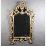 A 1950/60's Chippendale style plate mirror contained in a carved gilt wood frame 140cm x 83cm