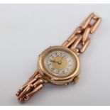 A lady's 9ct yellow gold wristwatch and expanding bracelet 21.6 grams gross with movement and glass