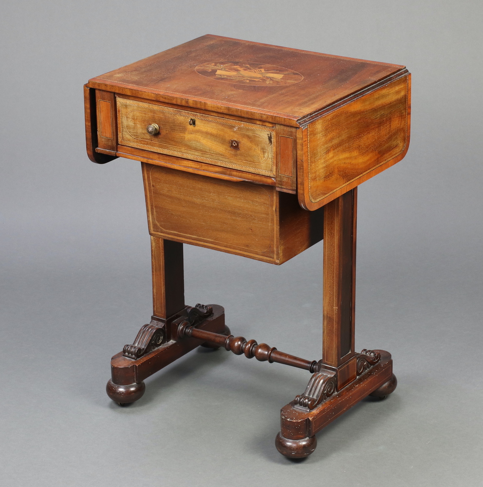 A William IV inlaid mahogany drop flap work table, the top inlaid musical trophies fitted a drawer