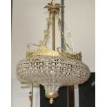 A gilt metal wire and glass squat shaped light fitting 29cm x 36cm