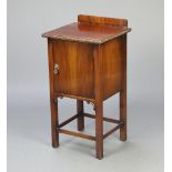 Waring and Gillow, a Chippendale style mahogany bedside cabinet with raised back, cupboard