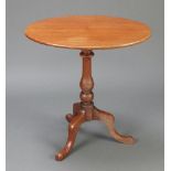 A 19th Century oval bleached mahogany snap top wine table raised on a pillar and tripod base 69cm