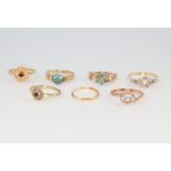 Six yellow metal gem set rings, size J, 11.8 grams and a 22ct gold wedding band 0.9 grams