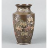 A 19th Century Japanese bronze vase decorated birds amidst branches, raised on a circular foot