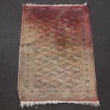 A red and blue ground Afghan rug with all over geometric design 145cm x 103cm (in wear)