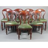 A set of 8 Victorian style slat back mahogany dining chairs with green leatherette overstuffed