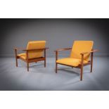 74 by A PAIR OF TEAK ARMCHAIRS