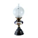 A VICTORIAN TABLE OIL LAMP, the blue ground porcelain fount hand-painted with a panel of figures,