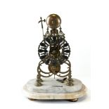 A VICTORIAN BRASS SKELETON CLOCK with silvered chapter ring and passing strike, on a marble base,
