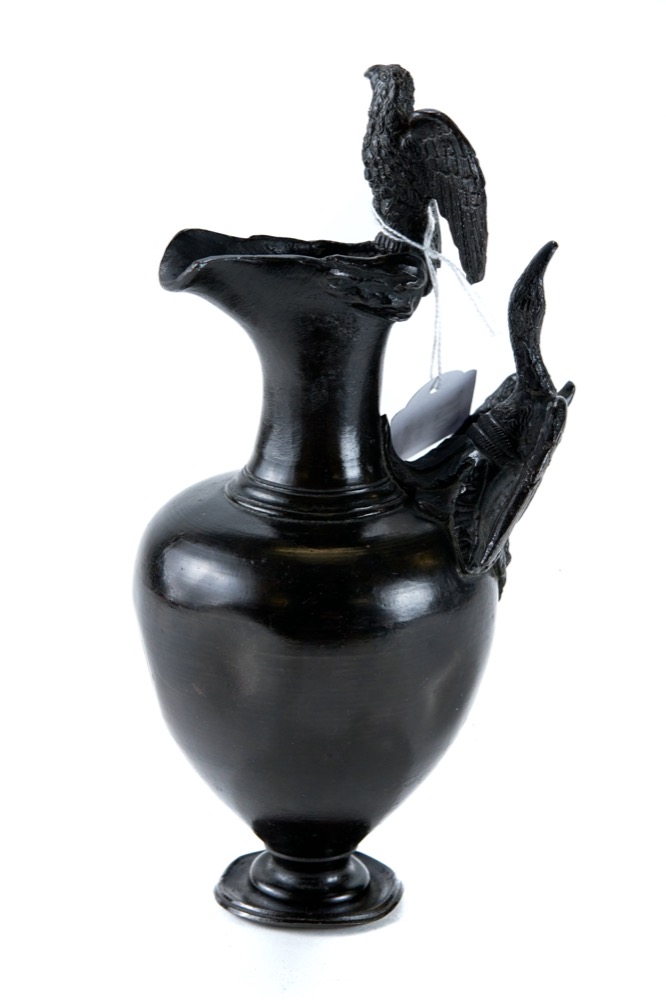 A 19th CENTURY GRAND TOUR BRONZE EWER, with bird form handle and bird adorned rim, 9 1/2" high.