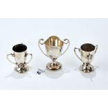 A PAIR OF EDWARDIAN SILVER THREE HANDLED TROPHY CUPS, maker F&S, Birmingham 1907,