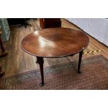 A GEORGE III MAHOGANY OVAL DROP FLAP DINING TABLE raised on tapered legs with pad toes,