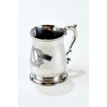 A GEORGE II SILVER BALUSTER SHAPED ONE-PINT TANKARD, engraved crest and scroll handle,