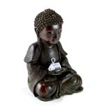 A SEATED CHINESE BRONZE BUDDHA, 9" high.