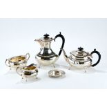 A GEORGE V SILVER THREE-PIECE TEA SET of oval panelled form, raised on four cabriole legs, maker: A.