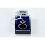 A 20th CENTURY YELLOW METAL MASONIC SPINNING FOB set with hardstones and square and compass motif,