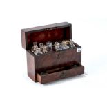 A 19th CENTURY MAHOGANY APOTHECARY'S BOX fitted with seven glass bottles and measure,
