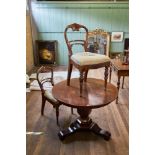 A 19th CENTURY CONTINENTAL MAHOGANY CIRCULAR TABLE raised on a hexagonal vase shaped column and