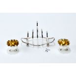 AN EDWARDIAN SILVER FOUR-DIVISION TOAST RACK, shaped reeded base and ball feet, maker: WDJ.