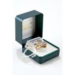 A 9CT GOLD FAUX-DIAMOND SOLITAIRE RING, size O, and a 9ct gold cross-over two-stone DITTO, size O,