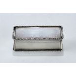 A FINE GEORGE IV RECTANGULAR SILVER SNUFF BOX, gilded interior and foliate moulded borders,