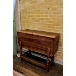 AN EARLY 19th CENTURY COUNTRY MADE DOUGH BIN, raised on baluster turned legs united by stretchers,