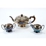 A GEORGE V SILVER THREE-PIECE TEA SET of circular form, maker: P.A.E.