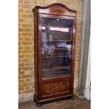 A 19th CENTURY CONTINENTAL MAHOGANY BOOKCASE, the shaped pediment above a glazed door,