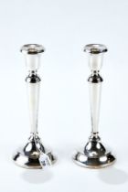 A PAIR OF ELIZABETH II SILVER TABLE CANDLESTICKS of tapering cylindrical design on a circular base,