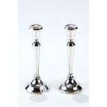 A PAIR OF ELIZABETH II SILVER TABLE CANDLESTICKS of tapering cylindrical design on a circular base,