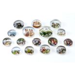 A COLLECTION OF SIXTEEN EARLY 20th CENTURY CIRCULAR PAPER-BACKED SCENIC PAPERWEIGHTS (16).
