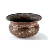 AN INTERESTING ANTIQUE CIRCULAR COPPER BASIN decorated with foliate border and roundels inc Coat of