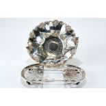 A 19th CENTURY SILVER-PLATED SWING-HANDLE FRUIT BASKET with foliate border, 10 1/2 ins diameter,