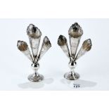 A PAIR OF LATE 19th CENTURY CONTINENTAL SILVER THREE TRUMPET VASES with embossed figures and putto