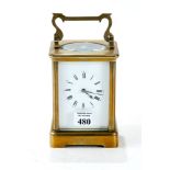 R & CO, PARIS, A LATE 19th / EARLY 20th CENTURY BRASS TWIN-TRAIN CARRIAGE CLOCK, striking on a gong,