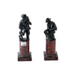 A PAIR OF 19th CENTURY GRAND TOUR BRONZES depicting a seated male musician and a standing female