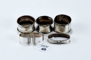 TWO GEORG JENSEN DANISH SILVER SERVIETTE RINGS, two hallmarked silver DITTOs, and a .