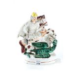 A 19th CENTURY STAFFORDSHIRE POTTERY FIGURE OF ST GEORGE AND THE DRAGON on an oval gilt lined base,