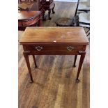 A GEORGIAN AND LATER MAHOGANY FOLD OVER TOP TEA TABLE with frieze drawer raised tapered legs with