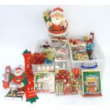 A large quantity of assorted Christmas decorations to include baubles, tinsel, Santa etc. Please