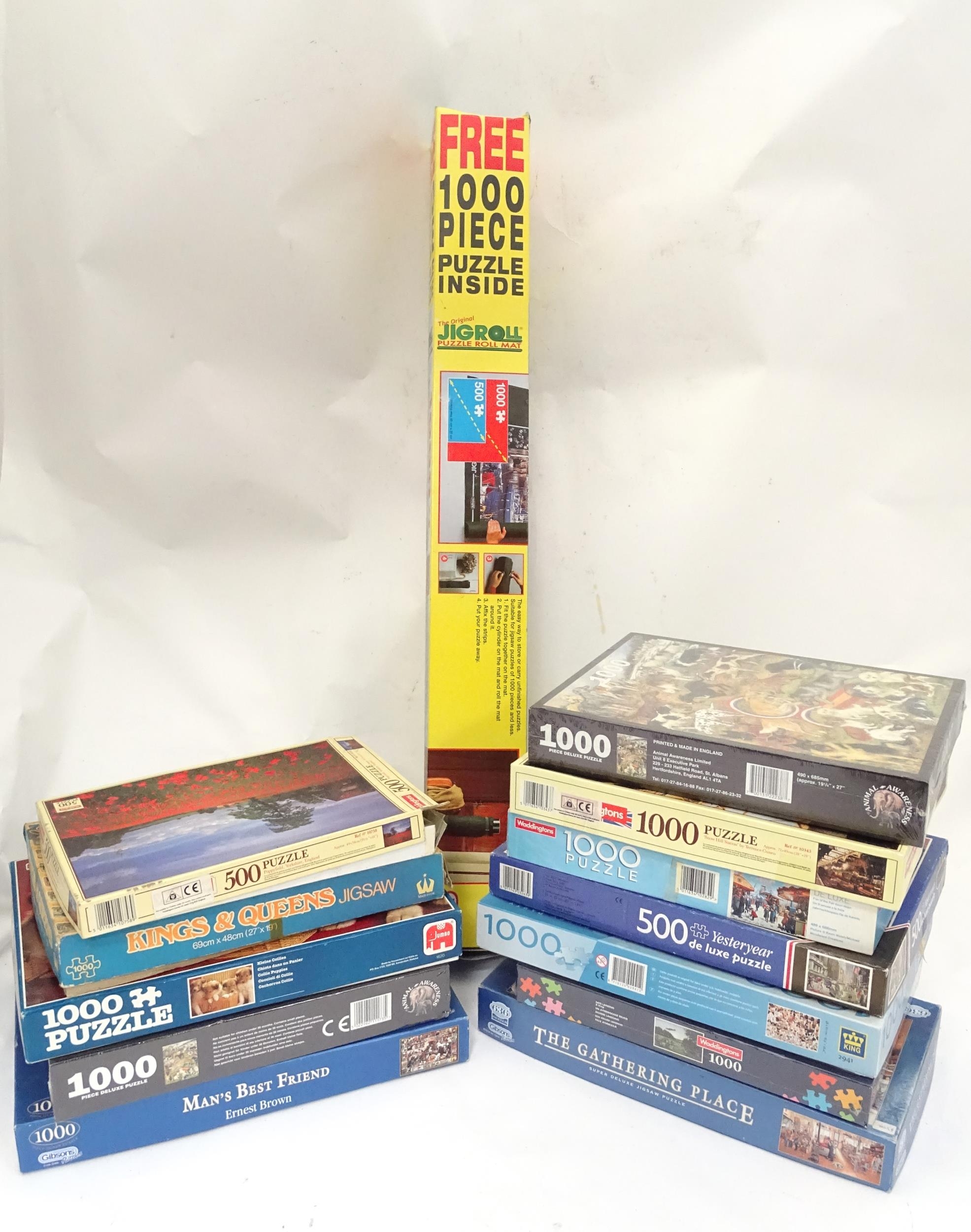 A quantity of jigsaw puzzles and a Jigroll puzzle roll mat Please Note - we do not make reference to