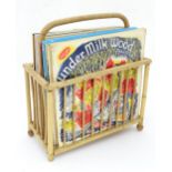 A quantity of 33/3 RPM vinyl records and wicker record rack Please Note - we do not make reference