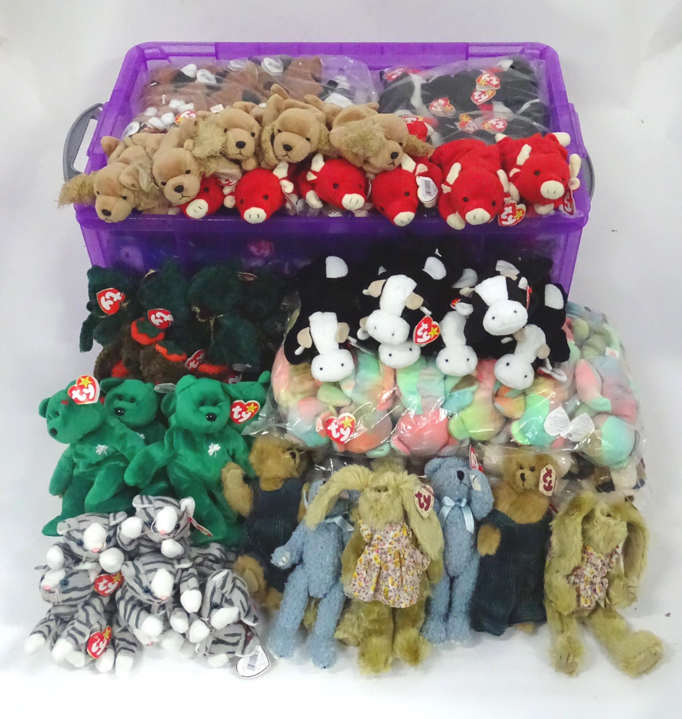A large quantity of TY Beanie Baby soft toys to include puffins, cats, birds, bears, sheep, cows,