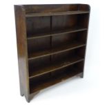 A 20thC oak bookcase with 5 shelves. Approx. 38" wide x 42" high x 8 1/2" deep Please Note - we do