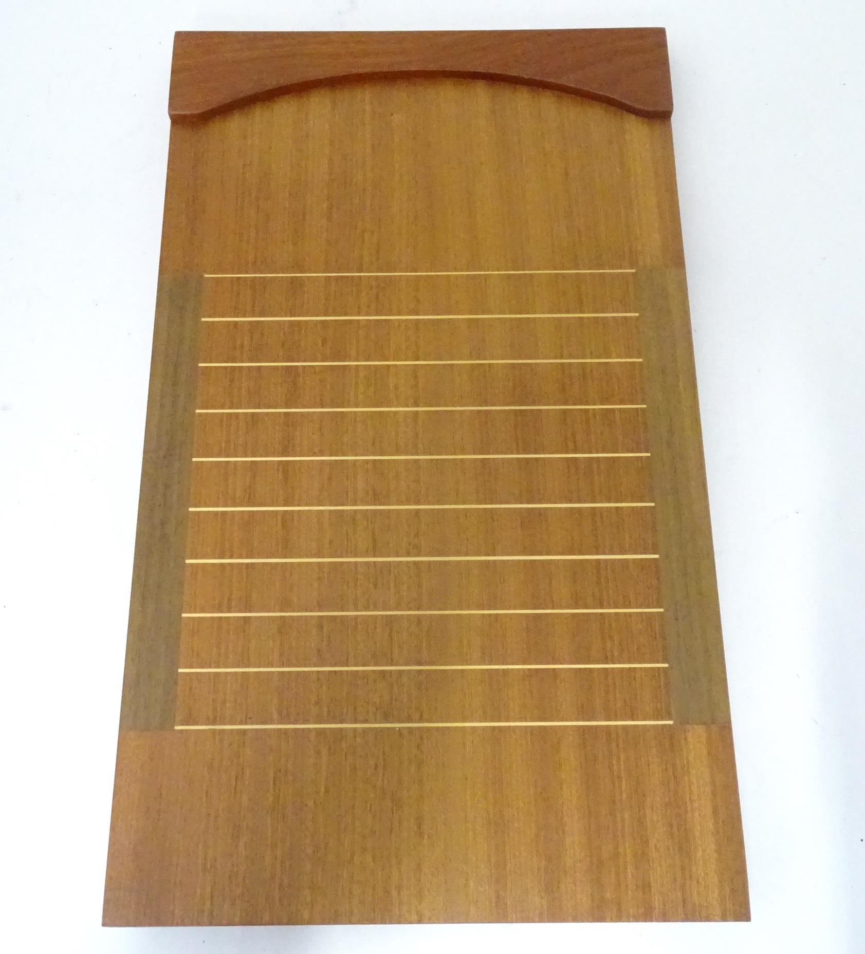 A teak shove ha'penny board with rules verso Please Note - we do not make reference to the condition