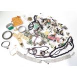 A quantity of assorted costume jewellery to include necklaces, beads, earrings etc. Please Note - we