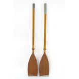 A two sectional wooden kayak paddle with protective end caps. Each approx. 49 1/2" Please Note -